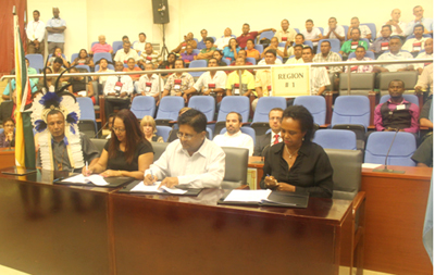 The signing of the Amerindian Land Titling contract:- From left: NTC Chairman Derrick John, Minister of Amerindian Affairs Pauline Sukhai, Minister of Finance Dr. Ashni Singh and UNDP Country Representative Khadija Musa