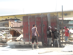 Construction workers building the fence yesterday.