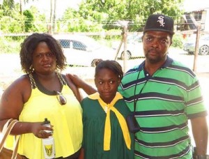 Vidol Anthony Rawlins, his wife and step daughter in happy times.