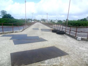 Metal sheets were placed over the large holes in the Supenaam Stelling to facilitate the safe passage of vehicles.