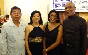 President David Granger and Tourism Minister Cathy Hughes share a happy moment with Chief Executive Officer [CEO) of MPS Limited, Stanley Ming and wife at the silver celebration. 