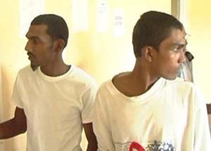 Neshan Jagmohan [right) and his brother Ramnarine during one of their court appearances.