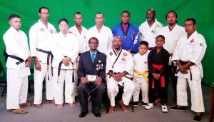 Grandmaster Stephen Monasingh [seated left) and Max Massiah (seated right) along with other Martial Artists at last Friday’s programme on NCN.