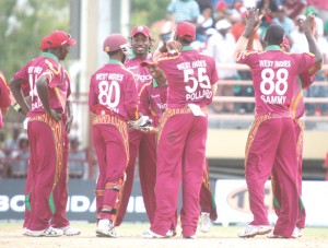 The West Indies players celebrate one of the wickets to fall as they applied the pressure on England. (Franklin Wilson photo)