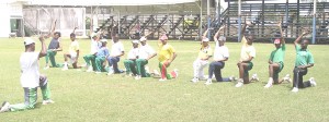 Coach Orin Bailey (left) taking his charges through a fitness session.