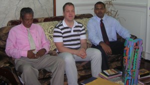 Rainer Bahmann flanked by Errol Tiwari (left) and Minister  Anthony moments after his arrival at the minister’s office.