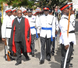  Justice James Bovell-Drakes inspects the Guard of Honour during yesterday’s ceremonial opening of the April criminal sessions