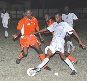  Intense action between Flamingo and Fruta  Conquerors in their 2-2 tie at the Tucville ground  on Sunday evening. (Franklin Wilson photo)  