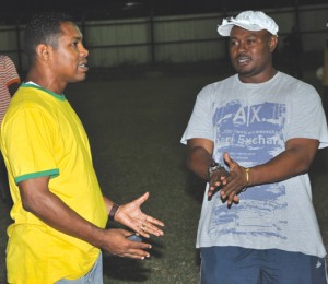 Presidential discussion between GFA's Troy Mendonca  (right) and Pele's Carey Jacques, both former national  players turn administrators. (Franklin Wilson photo)  