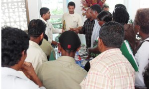 Farmers collecting planting materials yesterday at the Conference Centre.