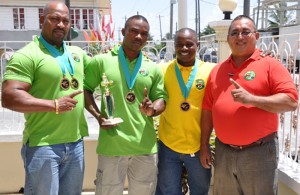 Guyana and Regional Powerlifting stars: (From left) ‘Big’ John Edwards, Randolph Morgan, Mervin ‘Spongy’ Moses and Manager Peter Green.  