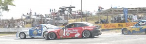 Paul Vieira leads his brother Mark around Turn 1 during a Group 4 race yesterday.