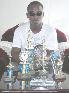 Meusa poses with a few of the accolades achieved during his short but illustrious career.