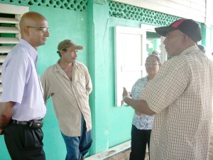 GWI Chief Executive, Yuri Chandisingh,  locked in conversation during his visit to Leguan 