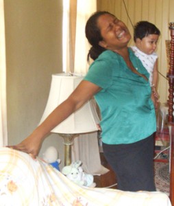 The dead man’s wife, Vanita, with her young son in arms is unable to accept the tragic news