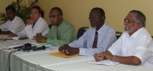 Burrowes (at centre) and his support team during yesterday’s press conference