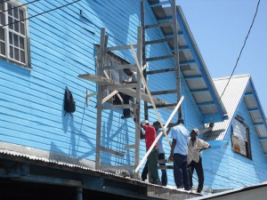  Workmen preparing to install new windows 