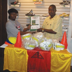 Roger Hinds (left) presents equipment  to Milerock’s President Bryan Joseph. 