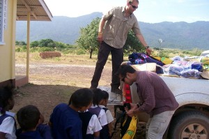 Embassy humanitarian personnel distribute school supplies to students of Kumu Primary School, Lethem