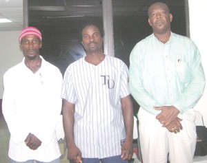 Facilitators of the programme pose for a photo opportunity; From left, Professor Christopher Norville, Sensei Troy Bobb and Master John Prescod.