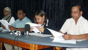 Minister within the Education Ministry, Dr Desrey Fox, in the company of other Education officials, ensures she gets the names of the outstanding candidates just right. 