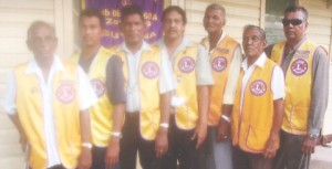 From left: Krishendat Durga, Rajesh Parsram, Madam Ramadar, Devindra Sookraj, Samuel Jaipersaud, Madam Ramadar, Devindra Sookraj, Samuel Jaipersaud, Madam Ramadar, Devindra Sookraj, Samuel Jaipersaud, Rhyle Sookraj, and Past President, Lowe Ghamandhi.