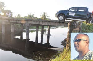 The bridge that contractor Roopan Ramotar (inset) said he was paid $26.3 million to complete,  but which the Ministry of Agriculture now claims is not part of works in Ramotar’s contract. 