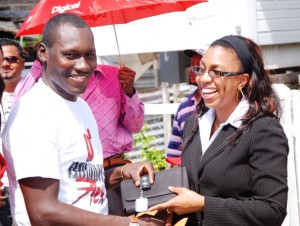 Sherwin Azore, 31, the winner of the second Digicel Bimmer on Wednesday collected the keys to the $24M Digicel Bimmer. At around 13:00 hrs the father of two received the keys to his BMW from Jacqueline James Head of Customer Care Digicel Guyana. The presentation was done at his Bagotstown home. Azore popped champagne with friends, well wishers among them the Digicel staff members who traveled to his home with the keys.  The few residents of Bagotstown who were there were not left out.  After celebrating he took the Bimmer for its first ride along the East Bank Road.  And as part of the celebration the barbers at the barbershop renamed it Digi-Cuts as a reminder that a barber from that shop won the multi-million-dollar car. 