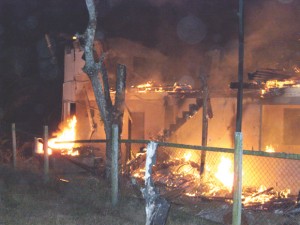 The burning building at Samatta Point, Grove.