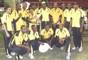 Chris Gayle and his victorious Jamaican team after winning the GCB 20/20 title at the Stadium on Saturday night. 