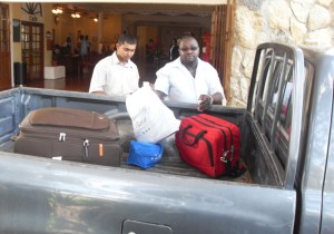 Police pack the man’s personal effects into a police vehicle