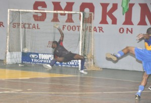 Western Tigers’ Delon Fraser (right) fires in the winning goal which evades the grasp of Alpha’s goalkeeper, Ronson Williams. (Franklin Wilson photo) 