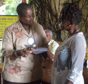 Maxine Cameron (right) of Sophia is  presented with her accolade.