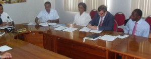 Ministry of Agriculture, Permanent Secretary Dr. Dyndial Permaul  and GFA’s Wolfang Haupt signing the contract on Monday.