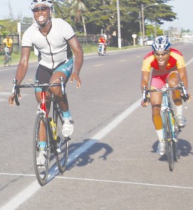 Flashback!!! A thrilling finish in the feature 20-lap race  Tyrone Hamilton (left) powering past the finish line  ahead of old rival Alonzo Greaves. (Franklin Wilson photo)  