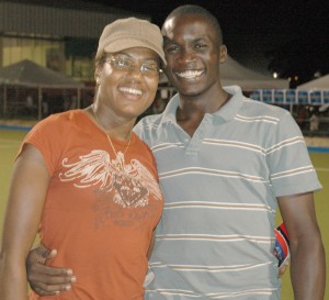 Old Fort’s Aderemi Simon poses  with a friend for Kaieteur Sport at  the last Caribbean Championships  which was held in Trinidad and Tobago.