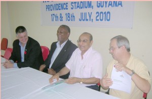 IRB Director of Technical Information, Professor Luis Padovani (right) holds up the CACSO Agreement after attaching his signature to the document. From left IRB General Manager, Tom Jones, Keith Joseph and GOA President, Juman Yasin share the historic moment.