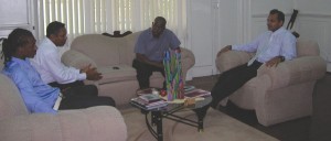 Minister of Sports Dr. Frank Anthony (right) entertains Gregory Richardson (left) along with  Parliamentary Secretary Steve Ninvalle (centre) and Pele FC President Cecil Jacques in discussion. 