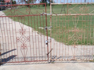 The padlocked gate of the softball ground,  which is at the centre of a land dispute.