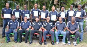 FIFA and Local Instructors (seated) pose with the top  achievers (standing) of the FIFA RAP MA Referees Course.