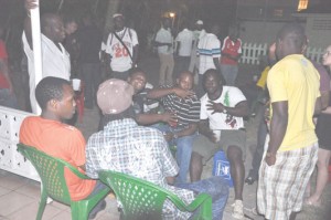 Rugby reception: caption- National Captain Theodore Henry  (white jersey sitting) and fellow members of the squad pose for  Kaieteur Sport last Friday evening, at Olympic House.