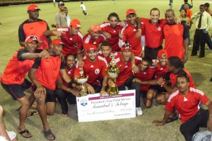 Champions again! The T&T team celebrate their success last night at the Stadium.