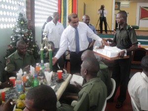 Commander-in-Chief of the armed forces President  Bharrat Jagdeo serving some of the ordinary Ranks after announcing  the one month Christmas bonus for the disciplined forces