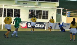 FLASHBACK!!! Nippy forward Ashley Rodrigues  (No. 9) unleashes a left foot shot which sailed  into the back of the nets in the 10th minute  against Suriname. (Franklin Wilson photo)