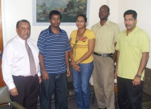 From left, Tony Yassin, President, Guyana Watch, Pooran Appadu and  fourth from left is Raynor Mc Andrew and other officials of Guyana Watch