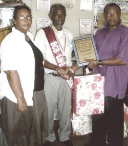 Malcolm Peters (centre) being inducted as a Life Member of the Berbice Cricket Board recently.