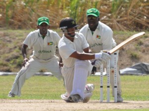 Baugh sweeps with disdain on his way to his 11th First Class century as Jamaica piled up the runs against Guyana yesterday (Sean Devers photo)