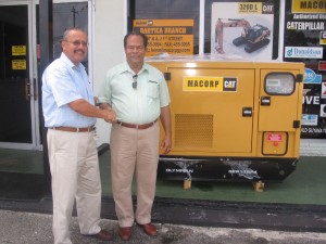 On the (left) Chief Executive Officer Jorge Medina handing over the Generating Set to the winner and representative of Teasar Mining Company, Theodore Adams (right).