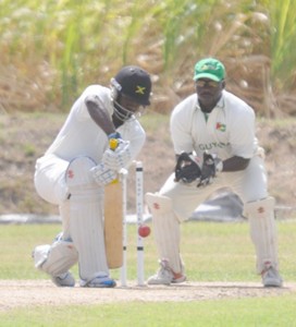 The experienced Wavell Hinds is all defence as during his responsible 21st First Class hundred yesterday (Sean Devers photo)