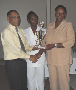 Nurse Terry Davis (at right) receives an award  for Region Six from Minister Leslie Ramsammy